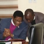 Paul Dajur with the Most Reverend Henry C. Ndukuba